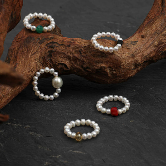 Pearl gemstone rings with green, red, and gold accents, round bead band