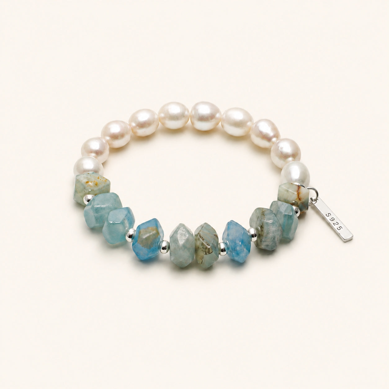 Pearl and blue gemstone stretch bracelet with silver S925 tag and faceted stones