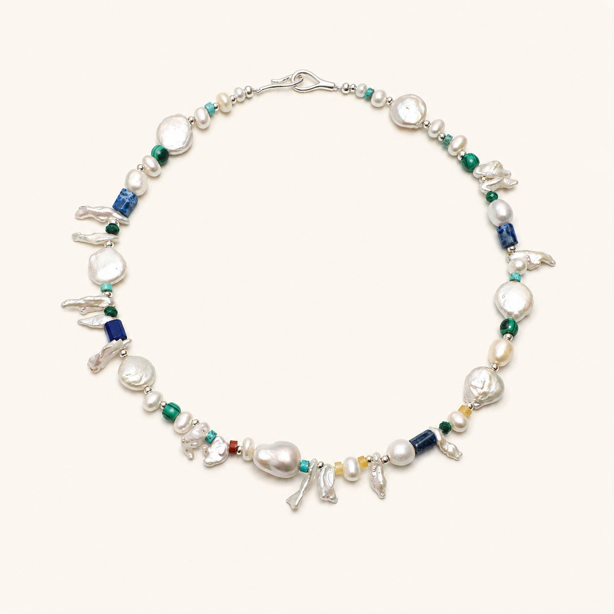 Pearl and gemstone baroque necklace with silver clasp, green beads, and blue lapis accents