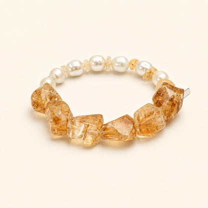 Citrine and pearl bracelet featuring amber faceted stones and round white pearls