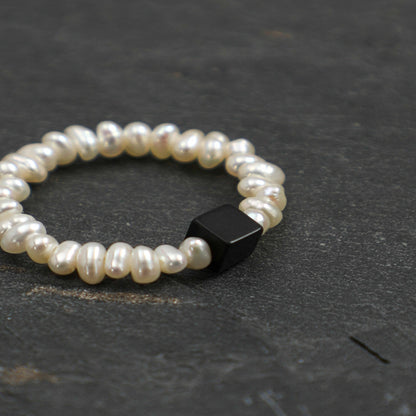 Pearl bead ring with black rectangular gemstone accent, round beaded band