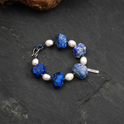 Lapis lazuli and pearl bracelet with blue cord and S925 tag; faceted stones and pearls