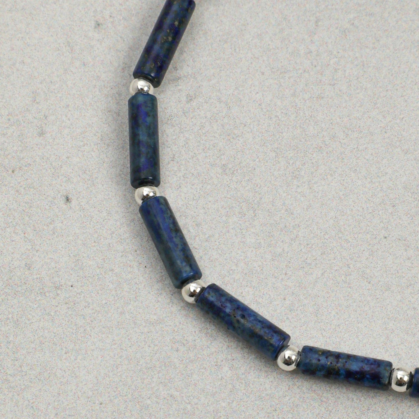 Lapis lazuli and pearl beaded bracelet with silver spacers and dark beads