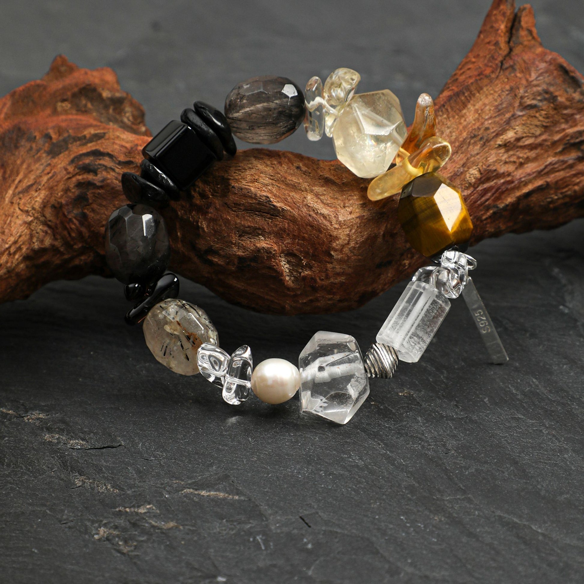 Beaded crystal and pearl bracelet with black beads, clear crystals, and pearl accents