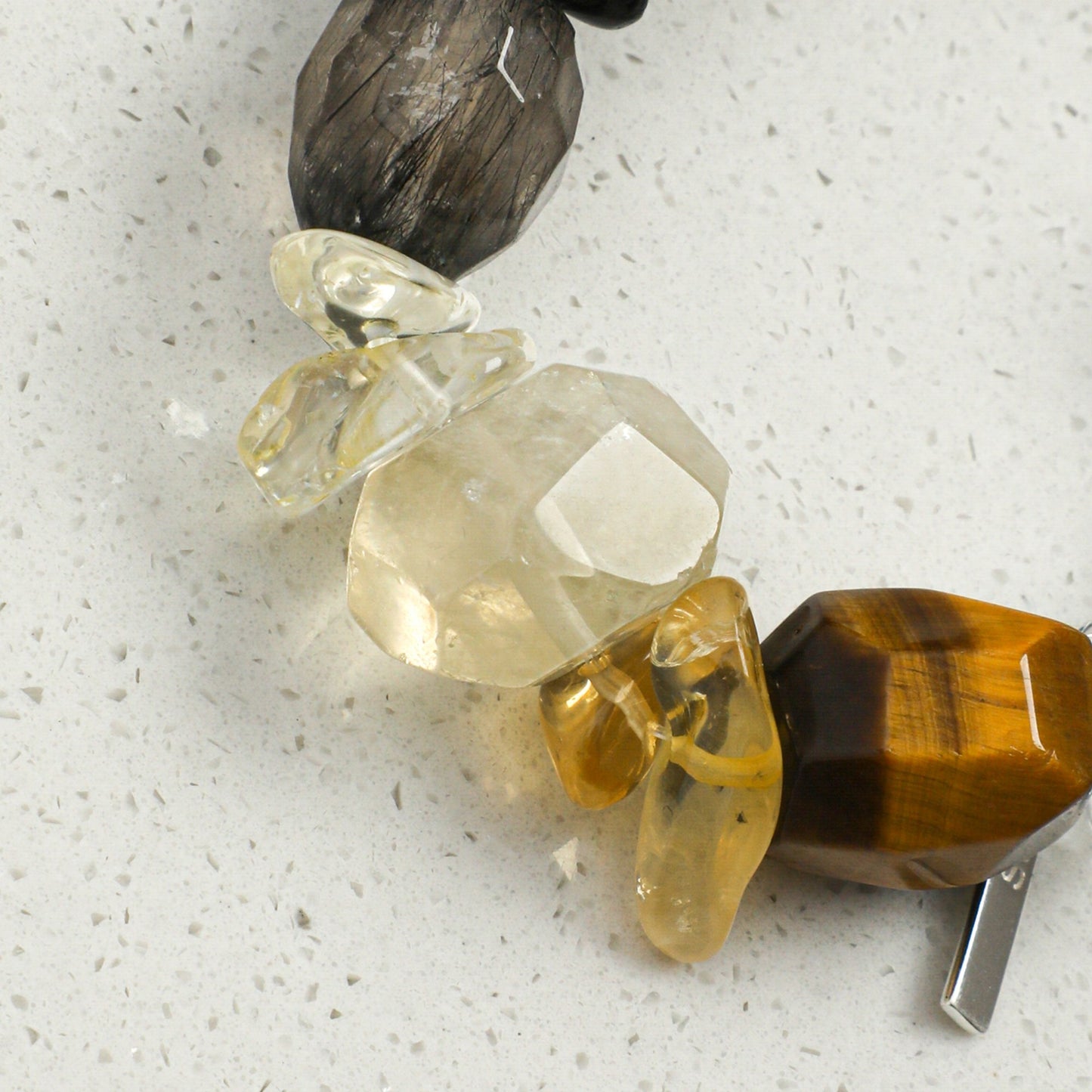 Crystal and pearl bracelet with amber and clear faceted beads and silver-tone clasp details