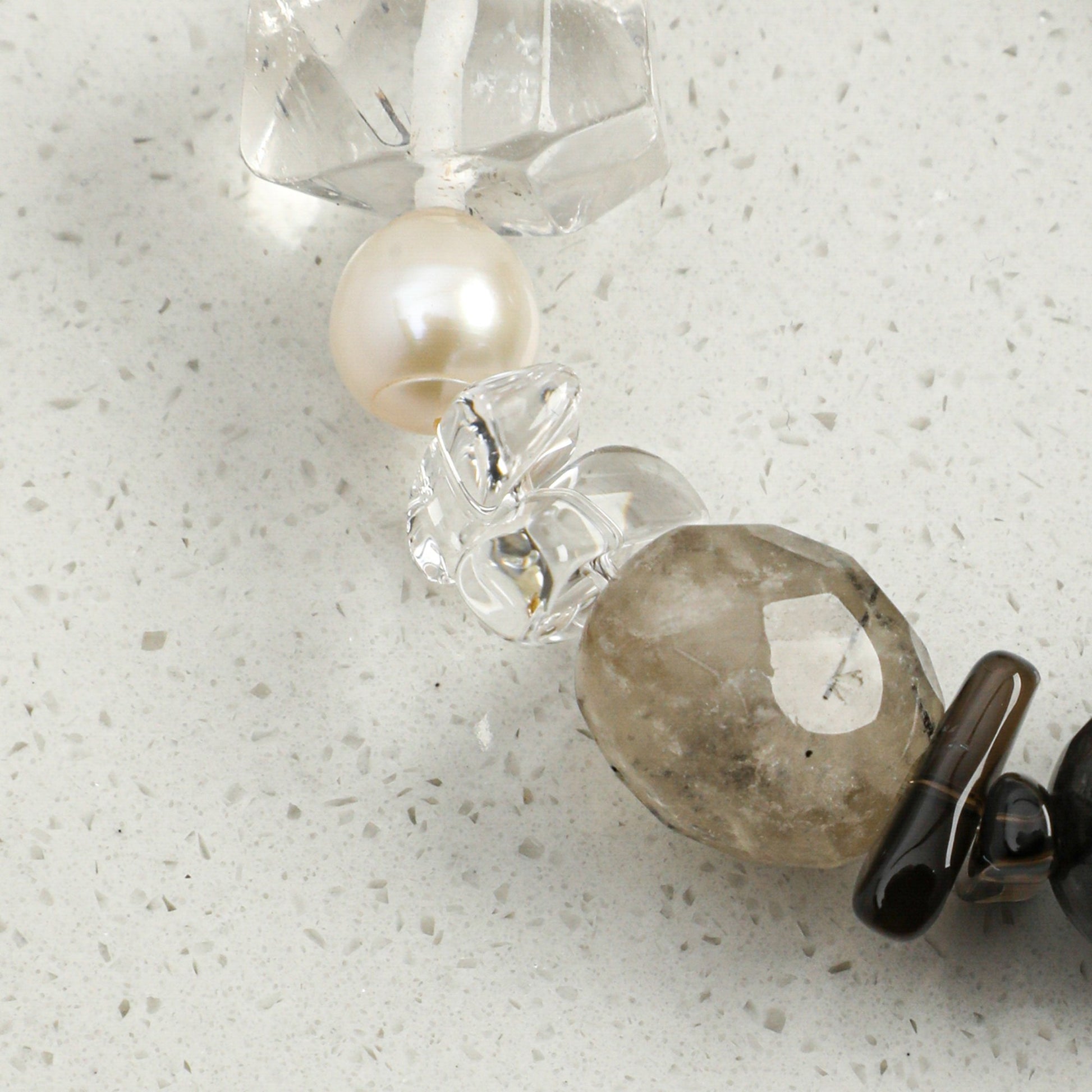Crystal and pearl bracelet with white pearl bead, clear crystals, and smoky gray stone