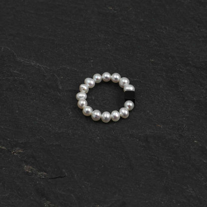 Pearl bead ring with dark rectangular gemstone accent, round beaded band