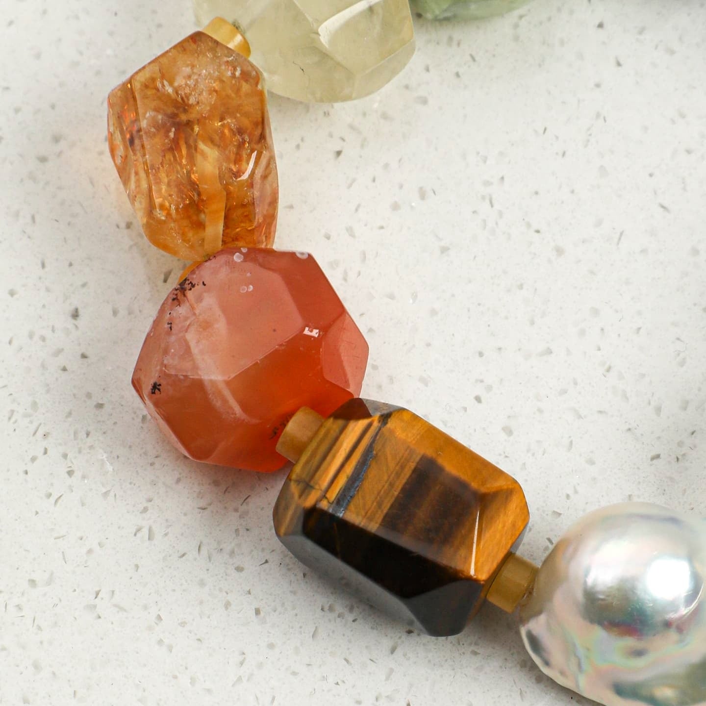 Orange to amber faceted crystal bead bracelet with round silver pearl charm