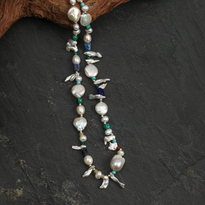 Layered pearl and gemstone necklace strand with long baroque pendants and bird charms
