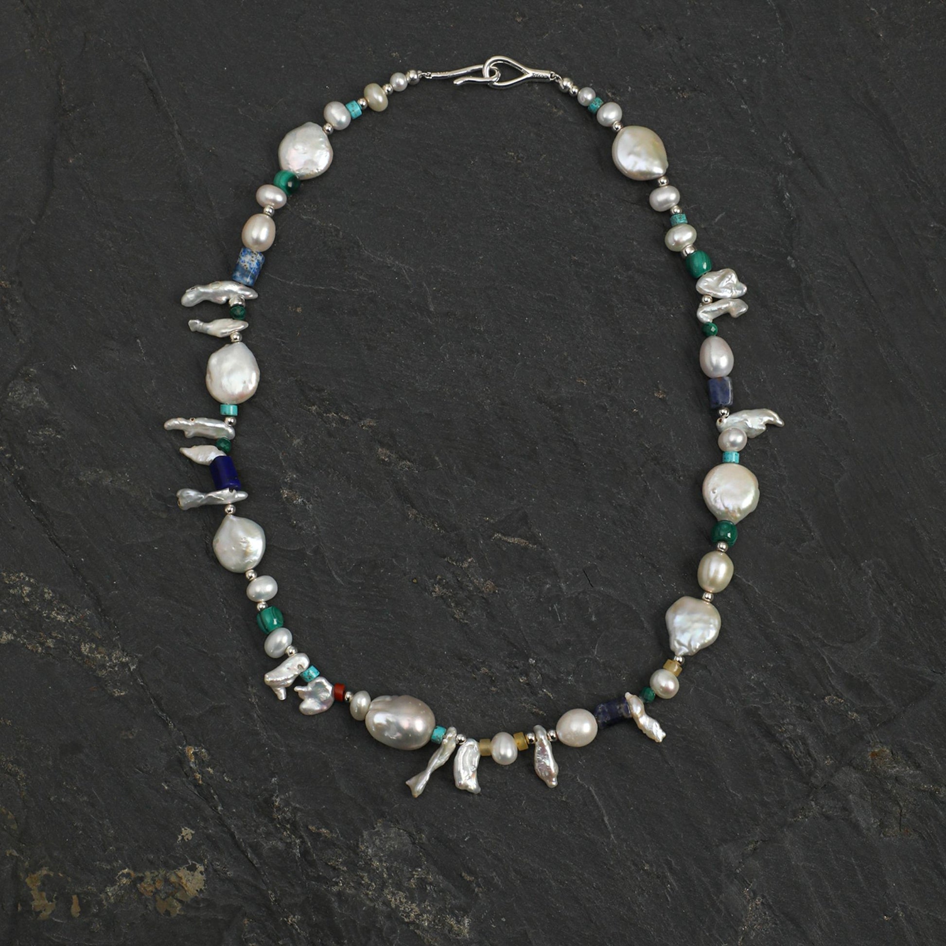 Baroque pearl gemstone necklace with silver tone links and small bird charms
