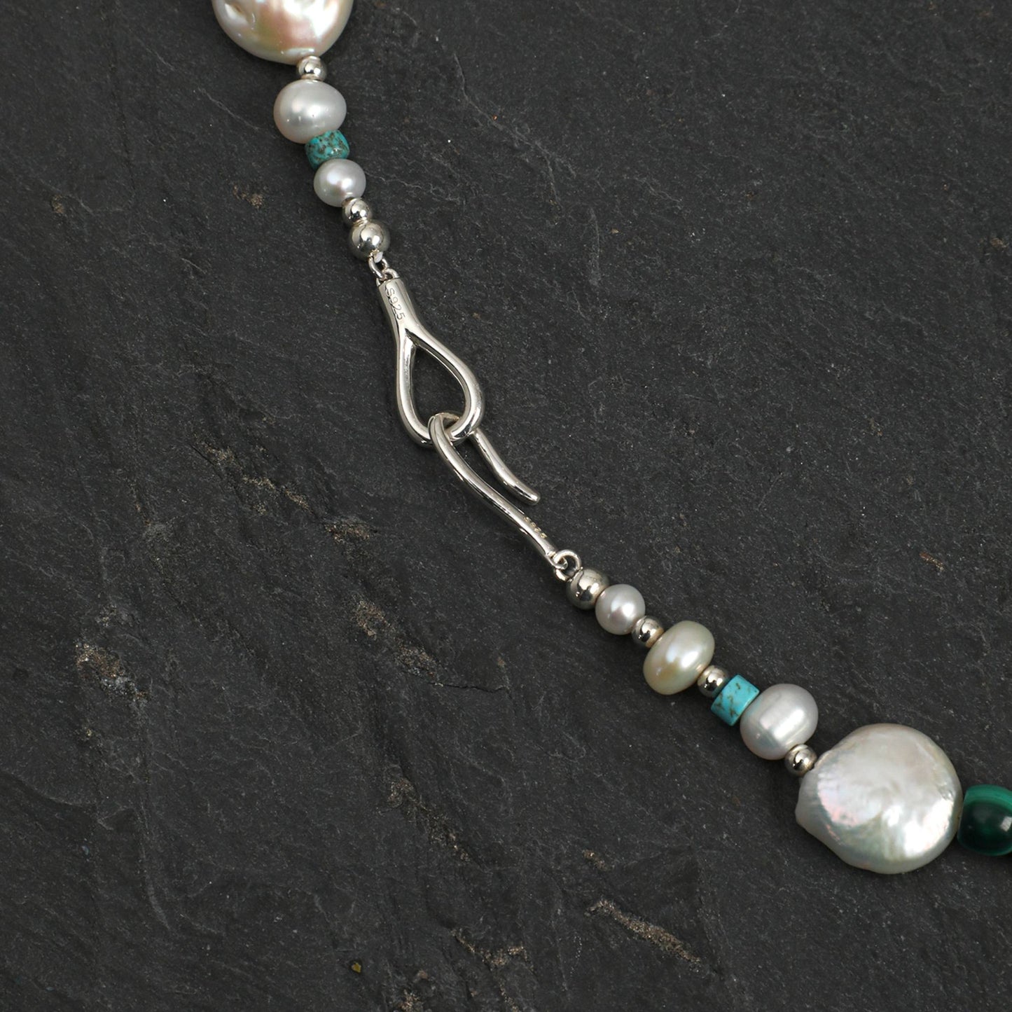 Silver-toned necklace with teardrop link, baroque pearl beads, and blue-green accents