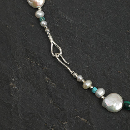 Silver-toned necklace with teardrop link, baroque pearl beads, and blue-green accents