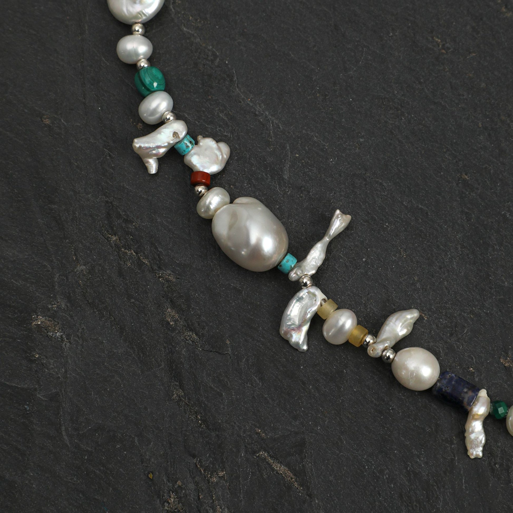 Baroque pearl and gemstone necklace with dangling bird charms, green and blue beads