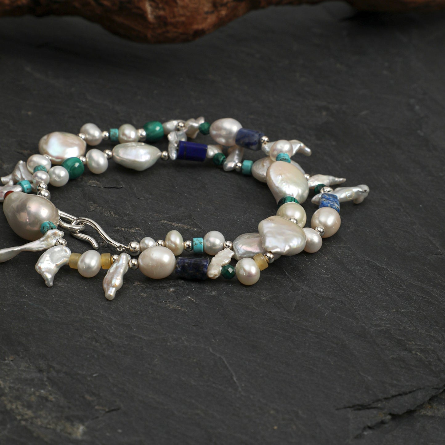 Set of pearl and gemstone necklaces with silver-toned links, baroque drops, and blue-green beads