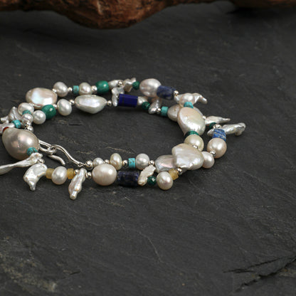 Set of pearl and gemstone necklaces with silver-toned links, baroque drops, and blue-green beads