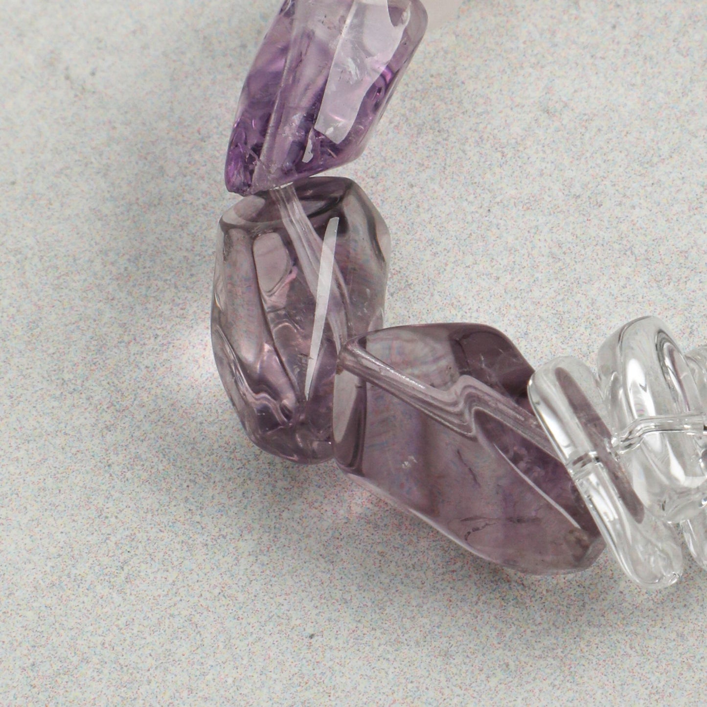 Amethyst and clear quartz bracelet segment with silver clasp and pronged setting