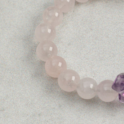 Rose quartz bead strand bracelet with smooth rounded pink beads
